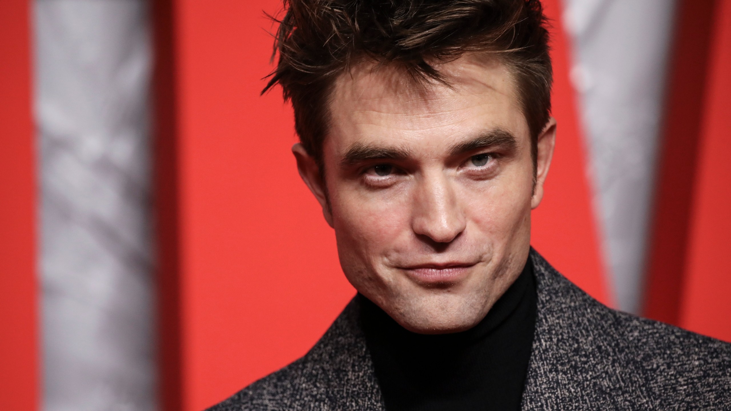 Robert Pattinson poses for photographers upon arrival for the screening of the film 'The Batman' in London Wednesday, Feb. 23, 2022. (Photo by Vianney Le Caer/Invision/AP)